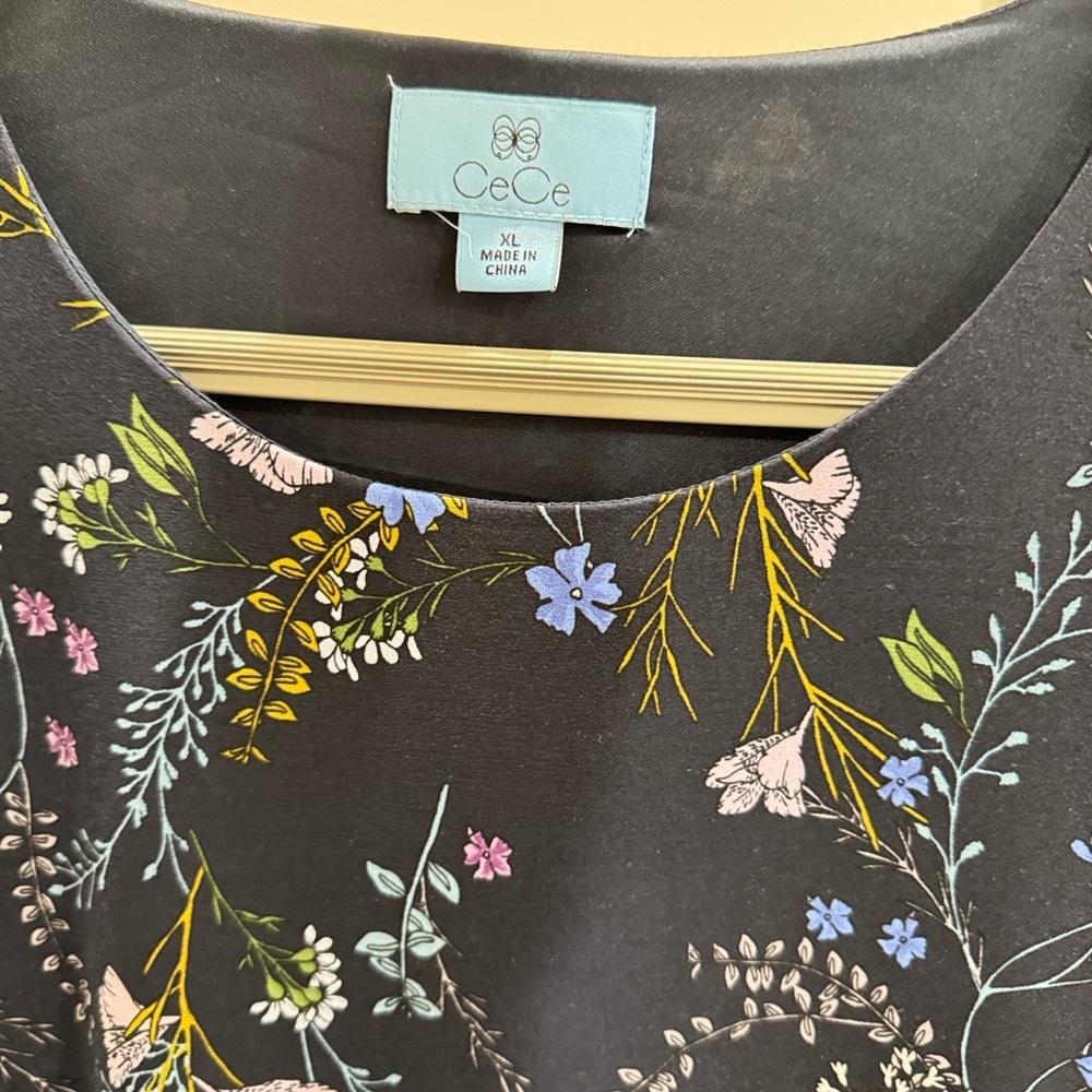 CeCe Black Top with Vibrant Floral Design